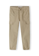 Boys cargo trousers in beige with elastic waistband and side pockets, front view.