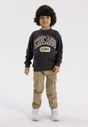 Boys grey cargo trousers with elastic waistband, featuring side pockets and a straight-leg cut.