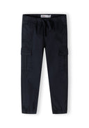 Boys navy woven cargo trousers with elastic waistband and side pockets, front view.