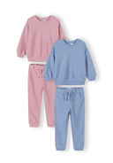 Two-piece girls tracksuit set in soft pink and blue with subtle heart design, stylish and comfortable for kids.
