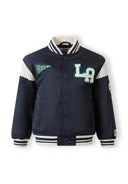 Navy padded varsity bomber jacket for boys with striped collar and sporty patch design on front and sleeves