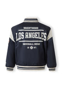 Back view of navy padded varsity jacket with Los Angeles baseball hero graphic and striped cuffs and collar design