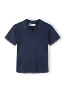 Boys knitted polo shirt in navy with short sleeves and v-neck detail.