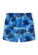 Blue boys swimming shorts with black turtle motif and elasticated waistband featuring quick-dry fabric design