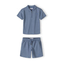 Boys blue pique polo shirt and shorts set, front view, features zip collar and elasticated waistband.