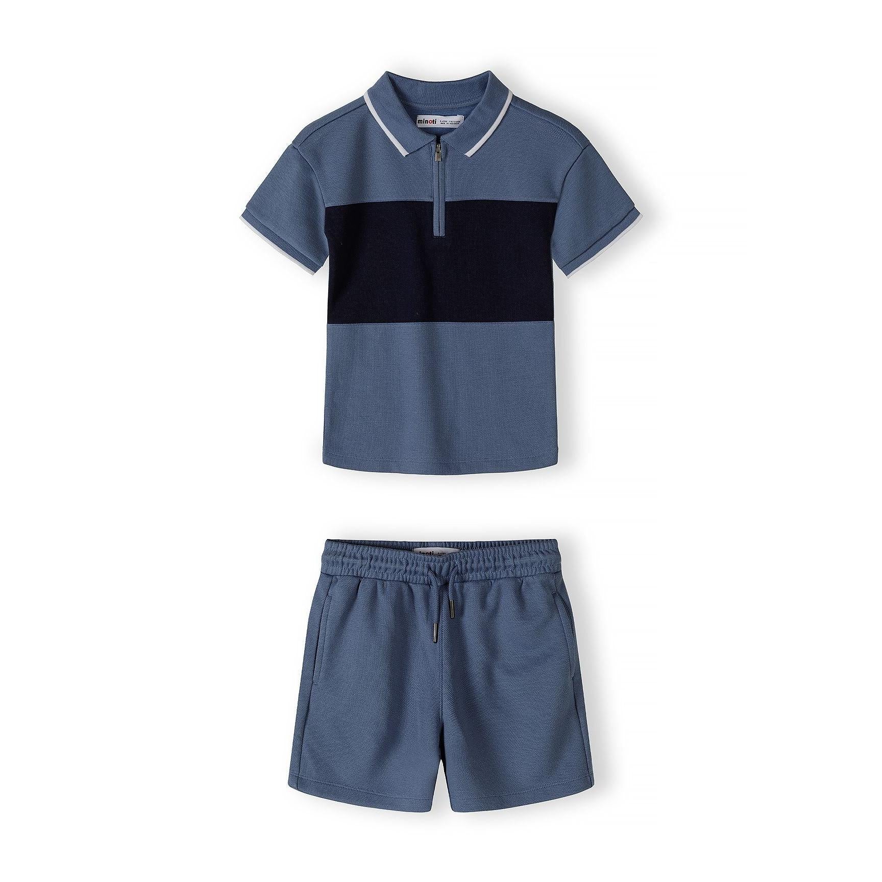 Back view of navy blue pique polo shirt showing plain design and collar detail against white background