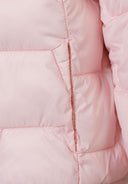 Detail of a girls' lightweight pink hooded jacket with quilted texture.