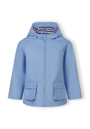 Light blue waterproof rain jacket for girls with hood and buttoned front pockets, designed for children’s fashion.