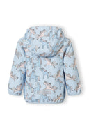 Back view of a girls' light blue softshell jacket with unicorn print and removable hood.