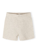 Beige girls' shorts with a simple, clean design, suitable for kids fashion and comfortable wear.