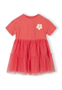 Girls jersey dress with orange multilayer tulle skirt and floral detail, front view.