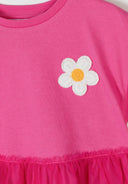 Pink girls jersey dress with crochet flower detail and layered tulle skirt showcasing unique design elements.