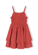 Girls red floral sleeveless summer dress with adjustable straps, front view.