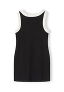 Back view of a sleeveless black ribbed jersey dress with white trim, showcasing a simple and stylish kids design.