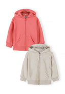 Two kids hoodies with front zip and pockets featuring simple, cozy design in coral and cream colors for toddlers and young children.