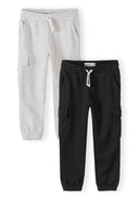 Two kids joggers in grey marl and black featuring cargo pockets and drawstring for a stylish, comfortable design.