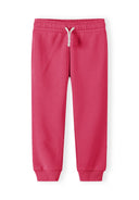 Pink kids joggers with an elastic waistband, white drawstring, and ribbed ankle cuffs, showcasing a simple design.