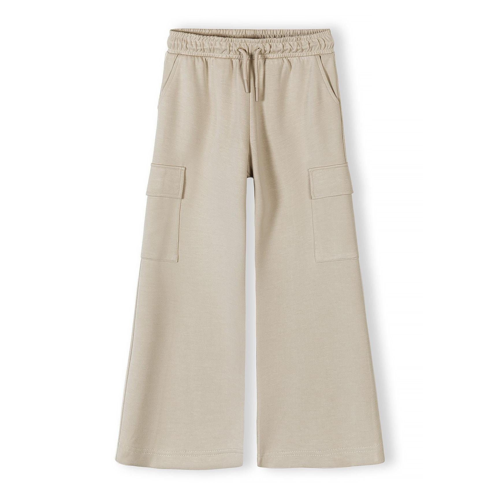 Beige wide leg joggers with cargo pockets flat lay on white background front view