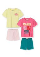 Two girls activewear sets with colorful tropical and Saint Tropez designs, featuring shorts and short sleeve tops.
