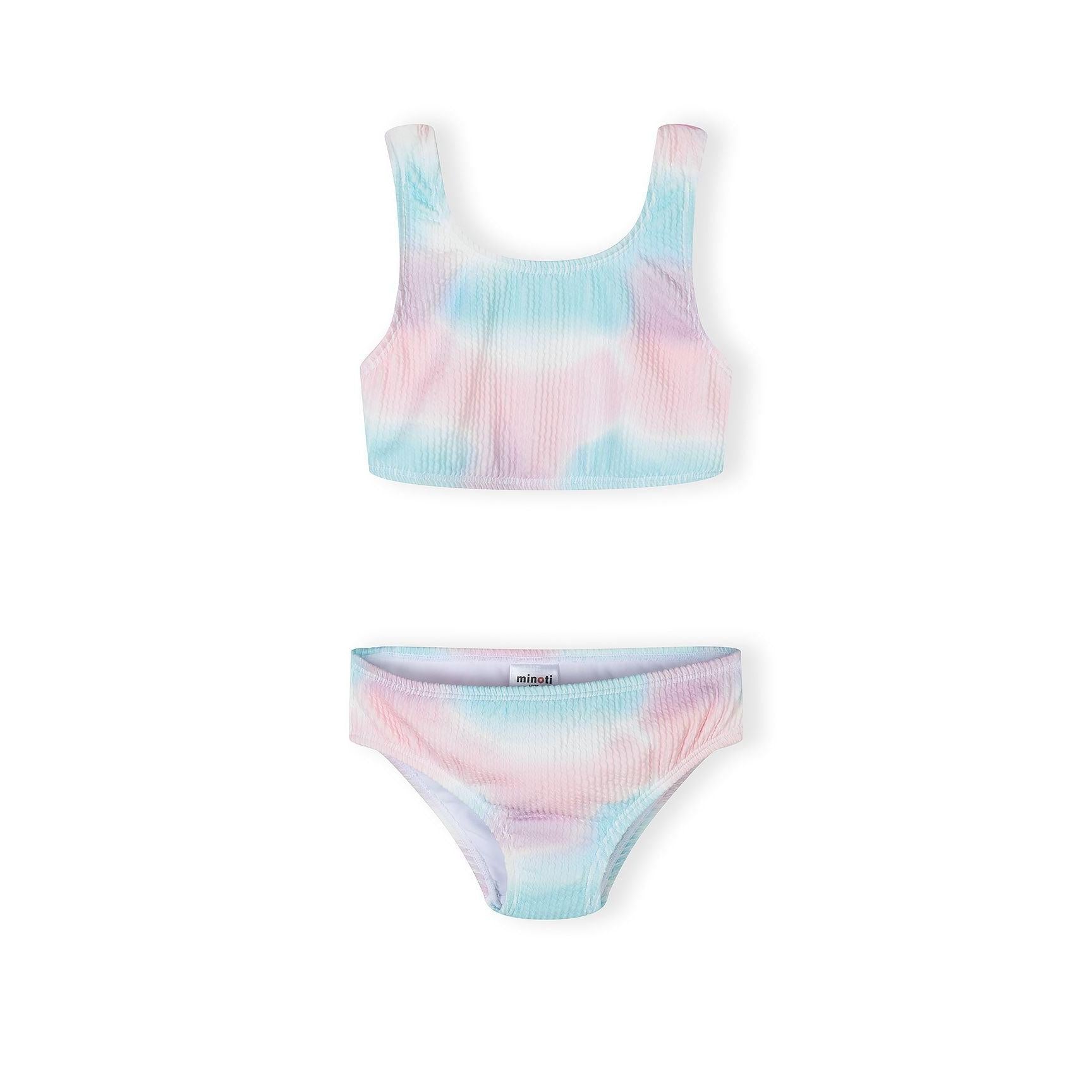 Pink and blue tie-dye bikini set with ribbed texture fabric displayed on white background, showing crop-style top with wide straps and matching bikini bottom