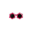 Pink flower-shaped sunglasses with dark lenses for children.