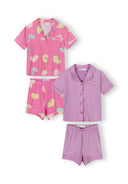 Two sets of girls' short sleeve pyjamas in pink heart print and solid lavender with button-up tops and shorts.