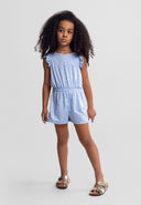 Young girl modeling a blue floral short sleeve jumpsuit with elastic waist, showcasing a comfortable kids fashion design.
