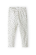 Girls heart print leggings in white with black heart pattern, soft fabric, elasticated waist, for ages 3m-3y.