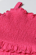 Girls smocked playsuit frill details pink 1-8y. Textured pink fabric with frilled details creating a playful summer look.
