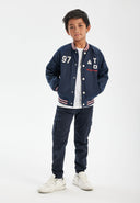 Boys satin bomber jacket with applique blue 3-14y featuring varsity design and contrast tipping for a sporty look.  