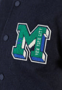 Boys baseball jacket in navy blue with green embroidered M patch and New York City stitching