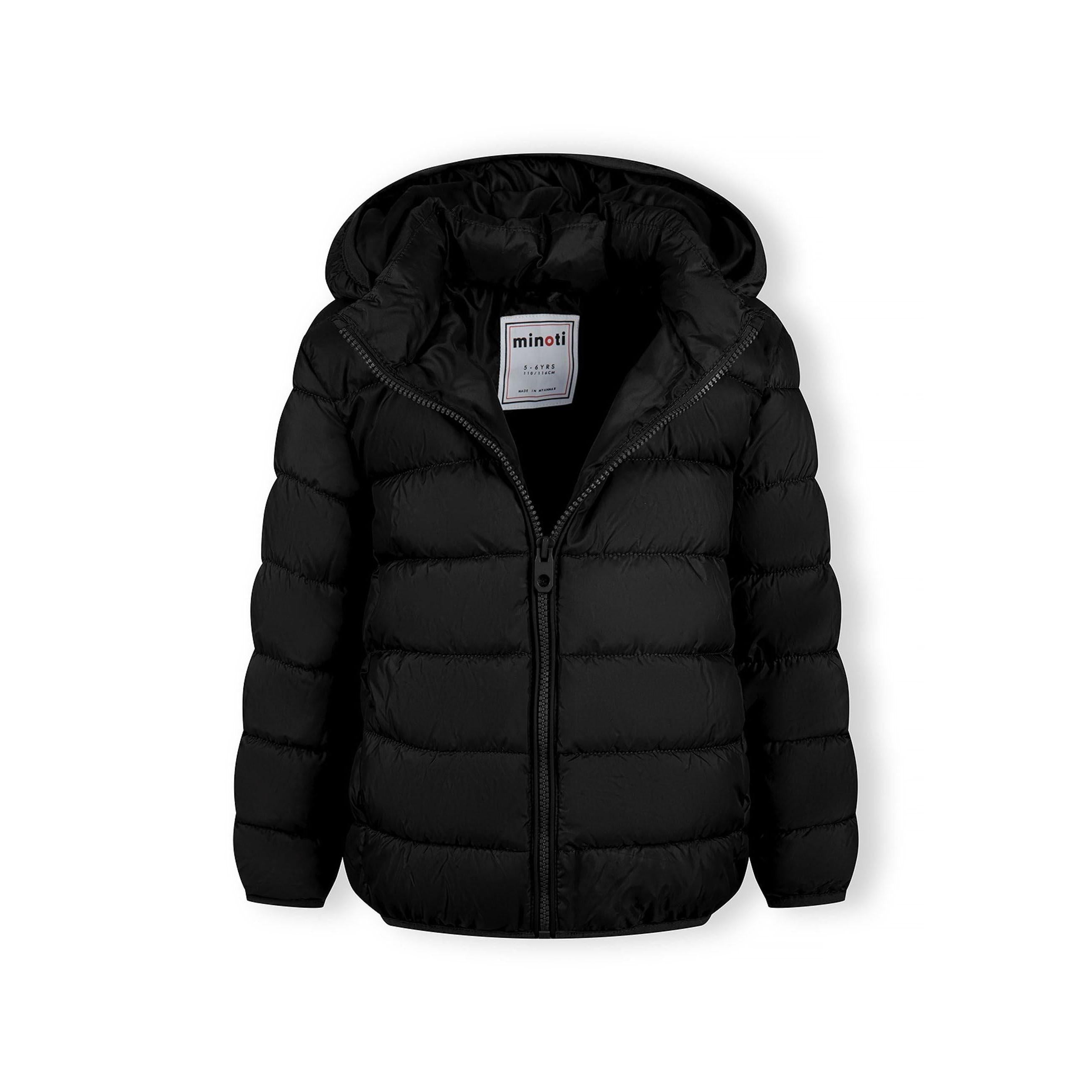 Detail view of black quilted jacket sleeve showing padded construction and embossed circular Minoti logo patch