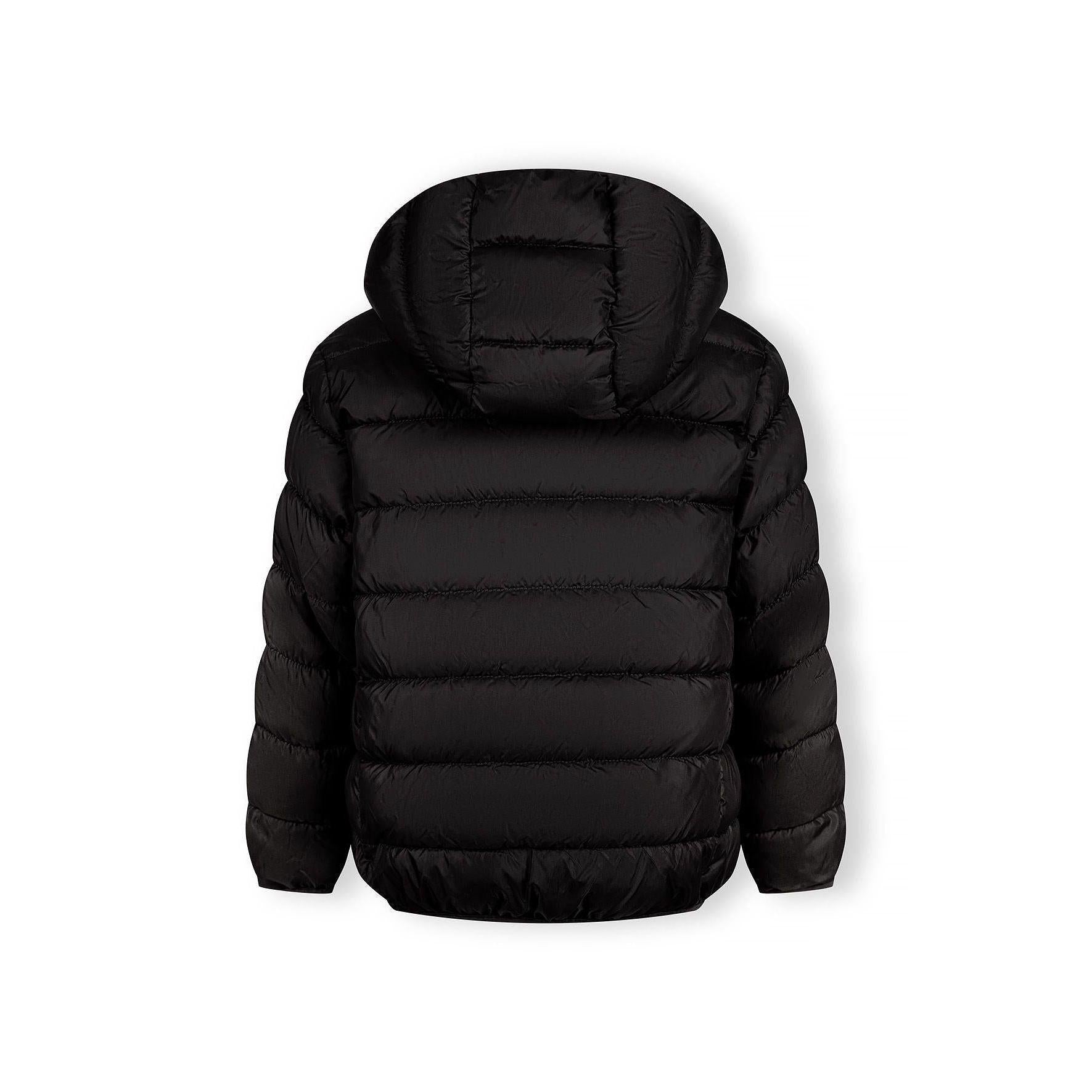 Detail view of black quilted jacket sleeve showing padded construction and embossed circular Minoti logo patch