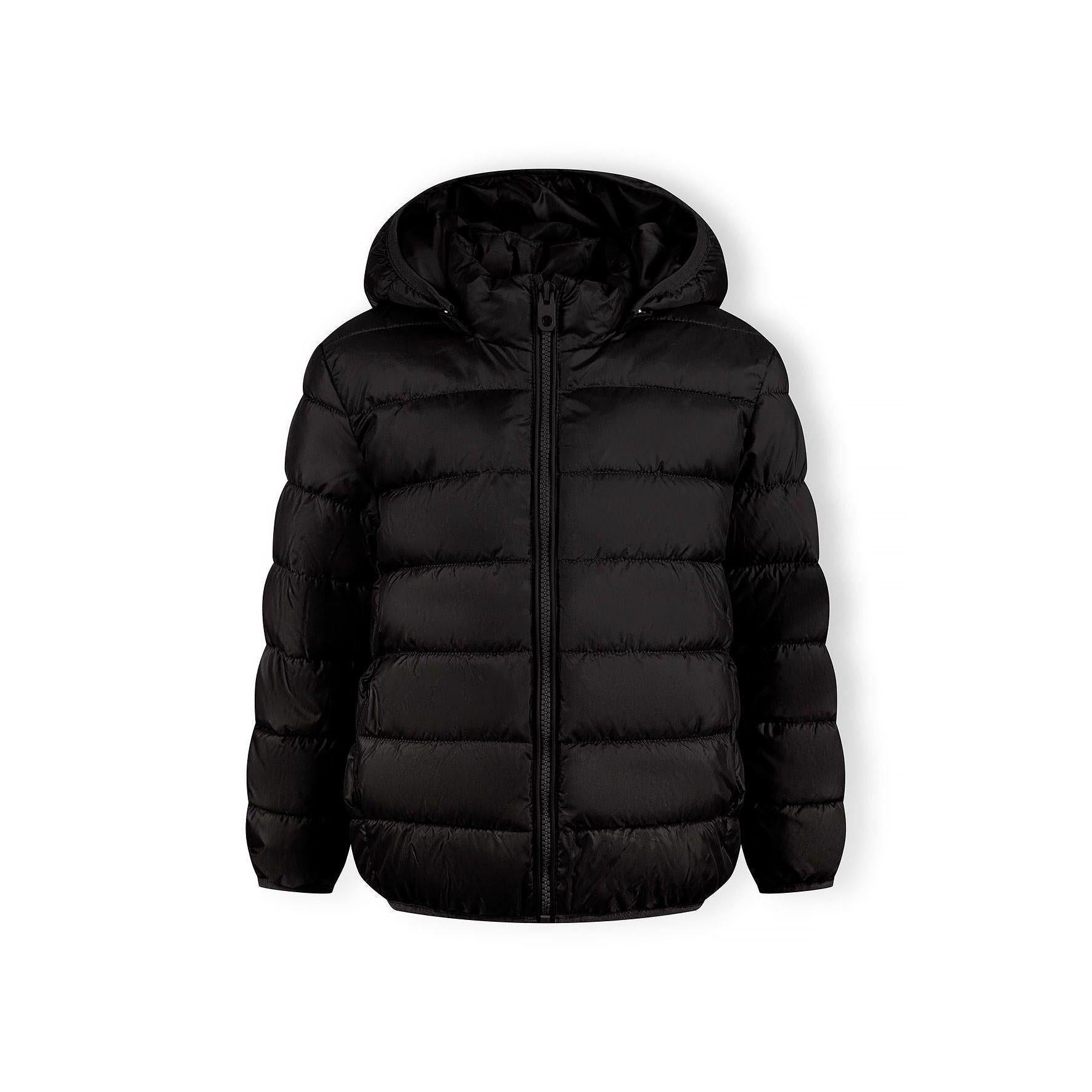 Detail view of black quilted jacket sleeve showing padded construction and embossed circular Minoti logo patch