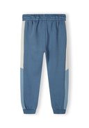 Boys joggers set with contrasting panels in blue cotton fleece, designed for ages 1-8y. Features an elasticated waistband.