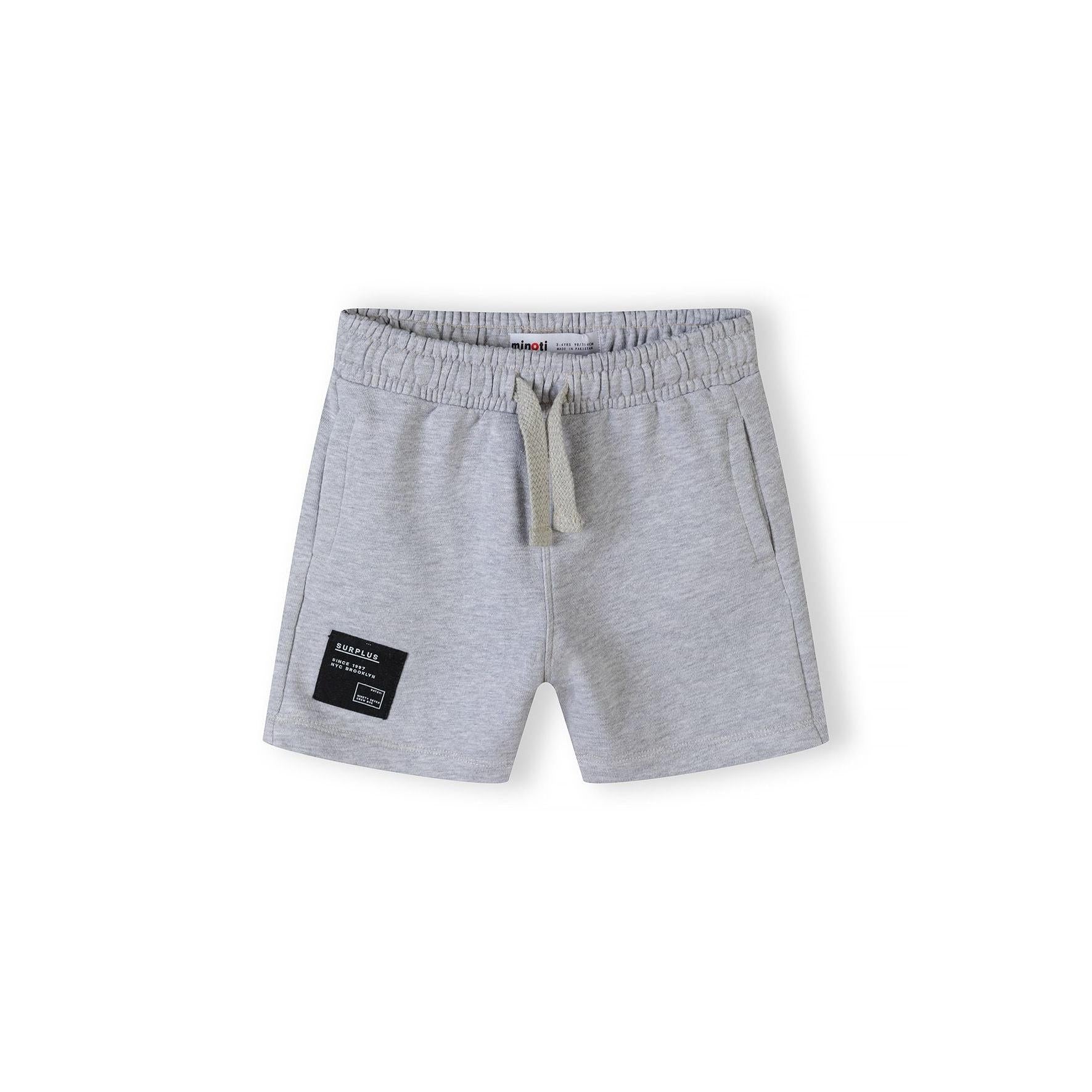 Grey fleece shorts with elasticated waistband, drawstring ties and black label patch, displayed flat against white background