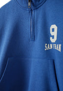 Boys half zip top with joggers cobalt blue 1-8y, featuring a zip collar, printed design, and kangaroo pocket. Perfect for casual wear.