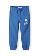Boys joggers in cobalt blue featuring elastic waistband and printed '9 SAN FRAN' design, suitable for ages 1-8 years.