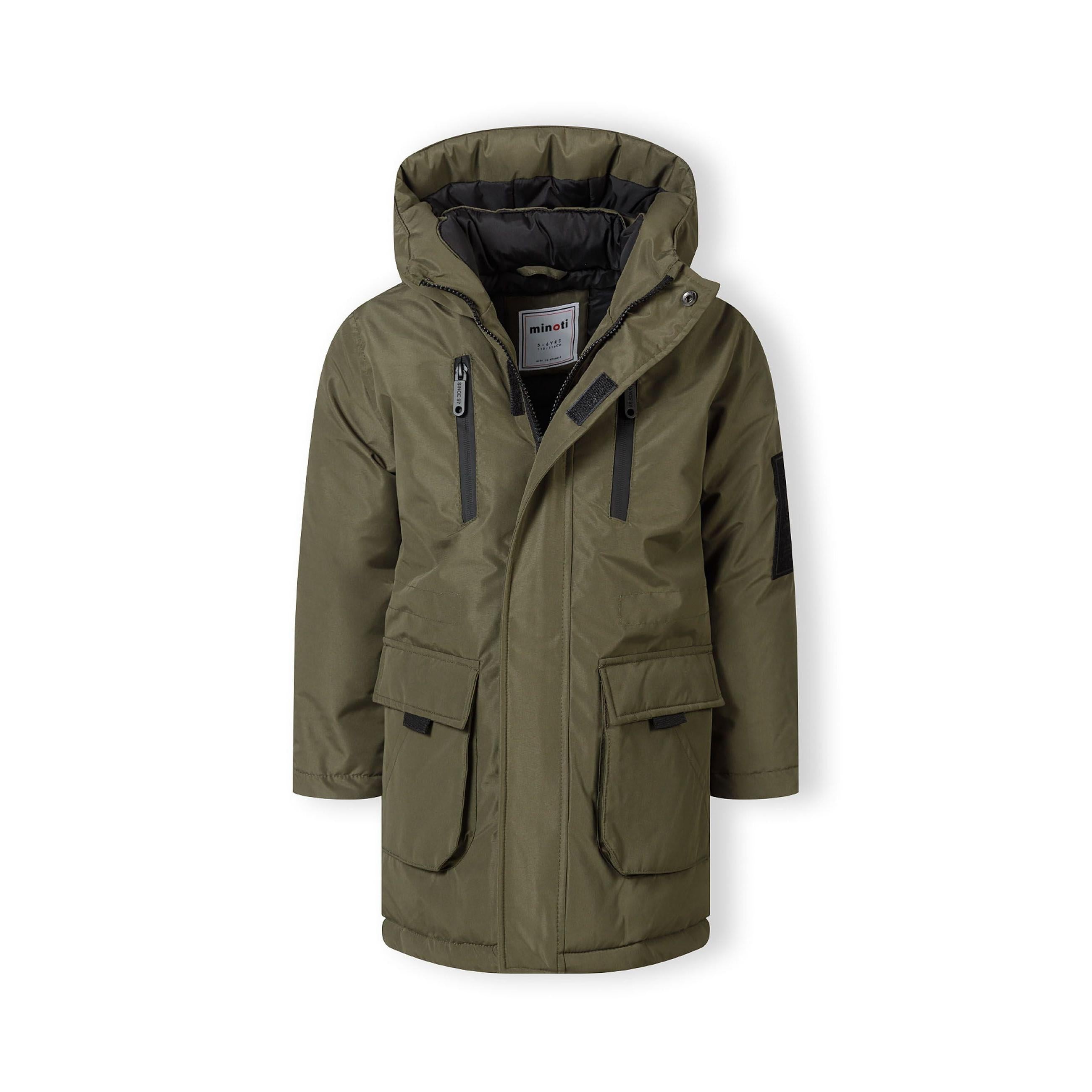 Close-up detail of khaki jacket back showing EST. 1997 white text print across hood area