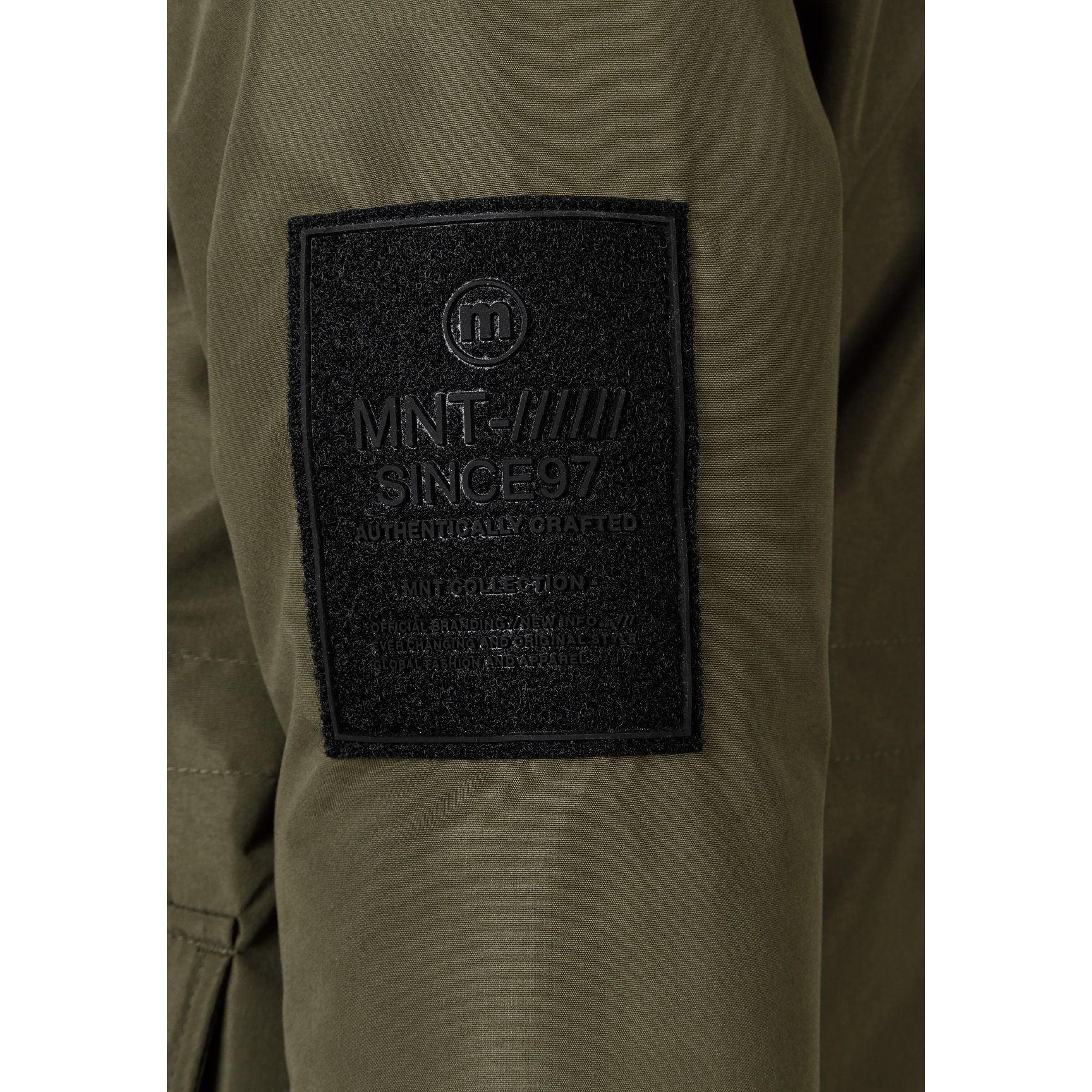 Close-up detail of khaki jacket back showing EST. 1997 white text print across hood area