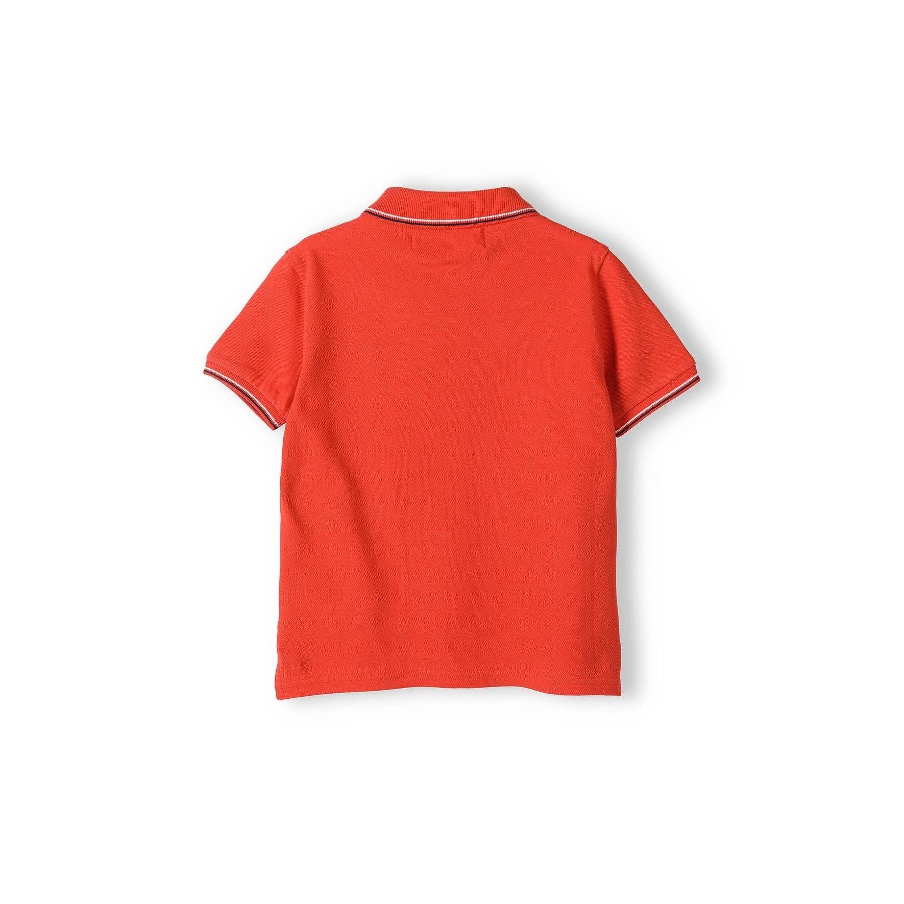 Back view of red polo shirt laid flat showing contrast tipping detail on collar and sleeves against white background