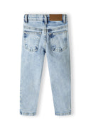 Boys ripped denim jeans in light wash faded blue with distressed look