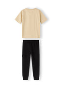 Boys short sleeve t-shirt with joggers set black 3-8y, featuring a beige t-shirt and black fleece joggers with pockets. Comfortable fit.