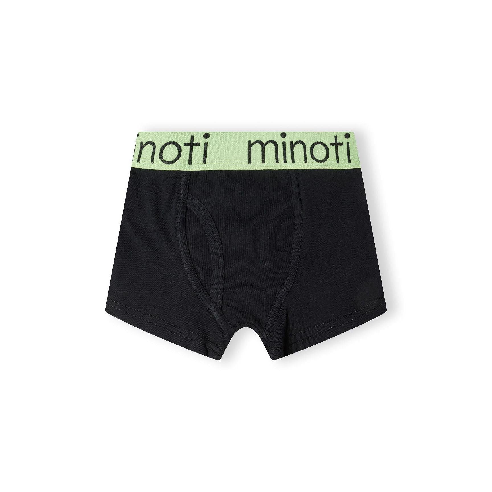 Single black trunk with pink waistband featuring Minoti branding, displayed flat against white background showing classic cut and construction