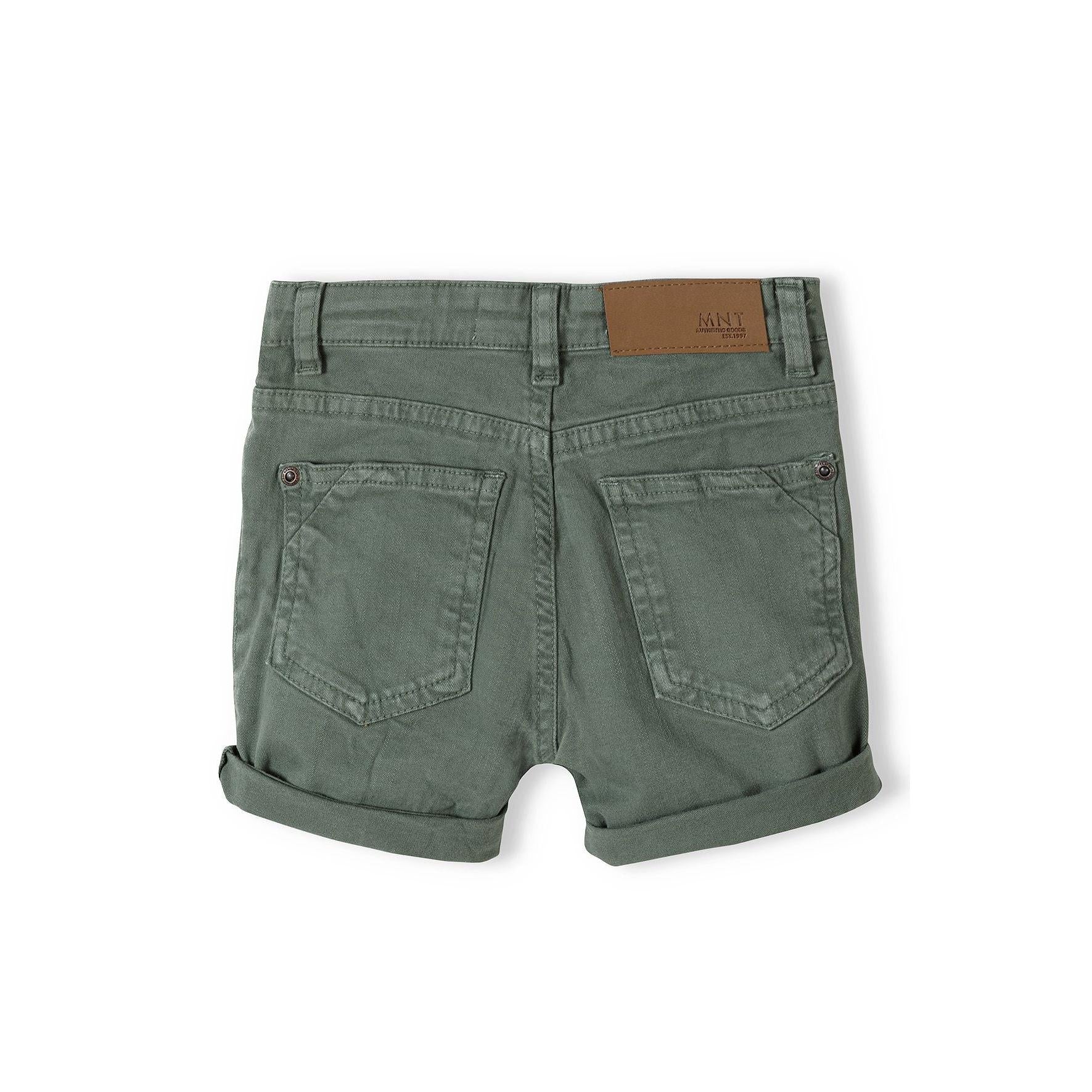 Back view of khaki twill shorts showing five pocket design with brown leather label patch
