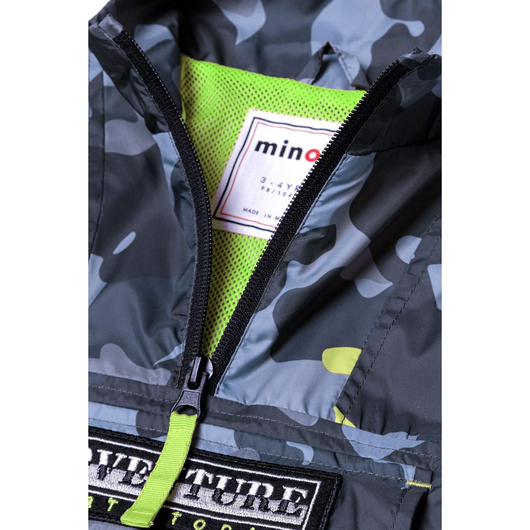 Close-up detail of unzipped windbreaker showing bright yellow mesh lining and Minoti brand label inside jacket