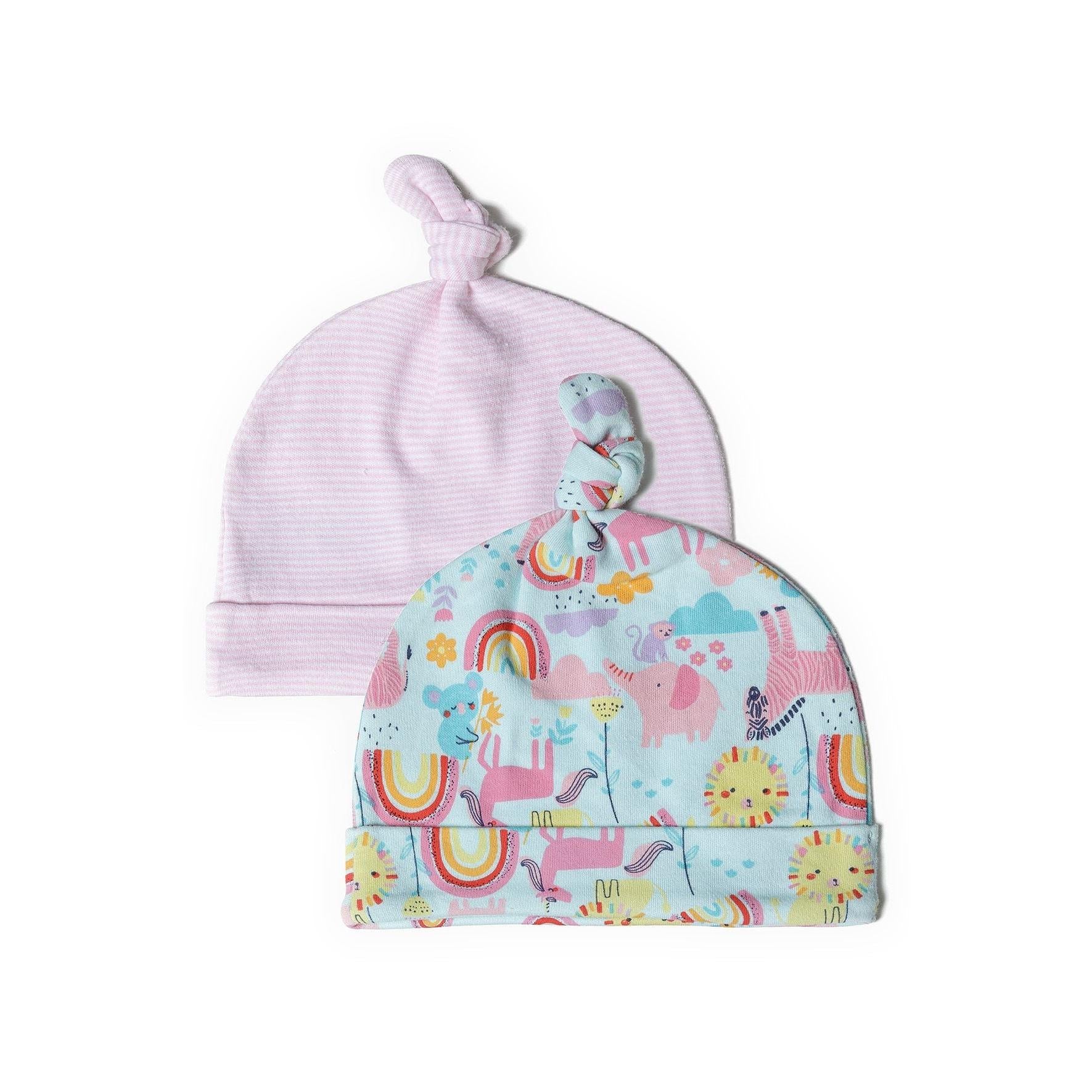 Two baby hats on white background - turquoise hat with rainbow dinosaur print pattern in front, lavender striped hat with knotted top behind