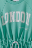 Oversized girls fleece dress in mint green with bold London graphic