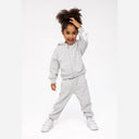 Smiling girl in a grey hooded fleece jacket with white sleeve panels and matching joggers.