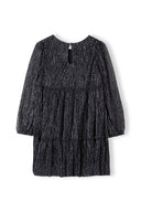 Black textured tiered girls party dress with long sleeves and ruffles